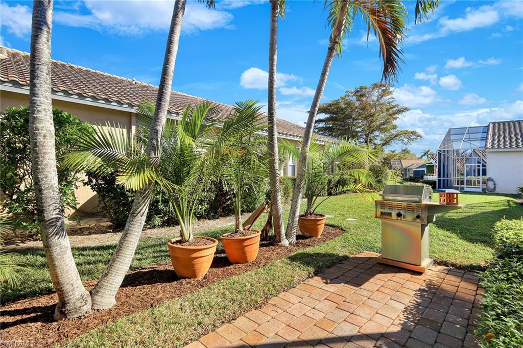 9354 Springview Loop Estero, FL 33928 - Photo 24 of 30 a view of a garden with plants