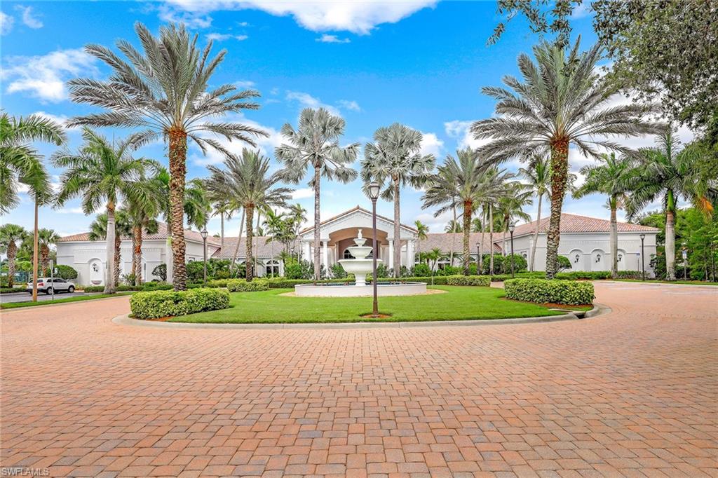 9354 Springview Loop Estero, FL 33928 - Photo 28 of 30 a view of a house with a big yard and palm trees