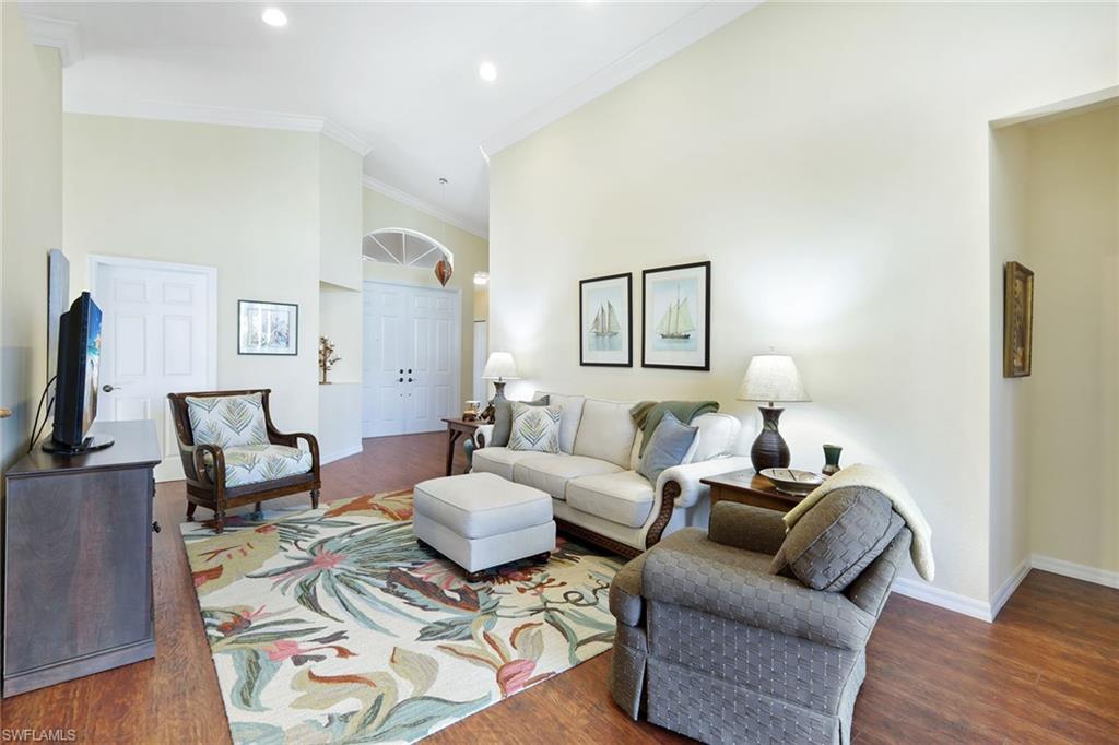 9354 Springview Loop Estero, FL 33928 - Photo 3 of 30 a living room with furniture and wooden floor