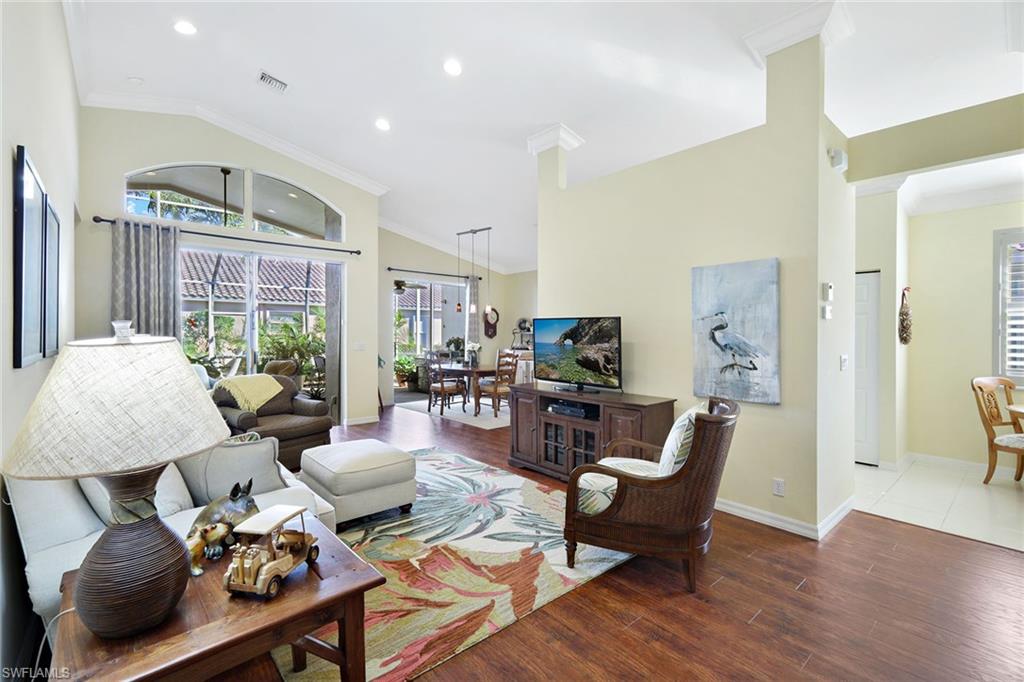 9354 Springview Loop Estero, FL 33928 - Photo 5 of 30 a living room with furniture and wooden floor