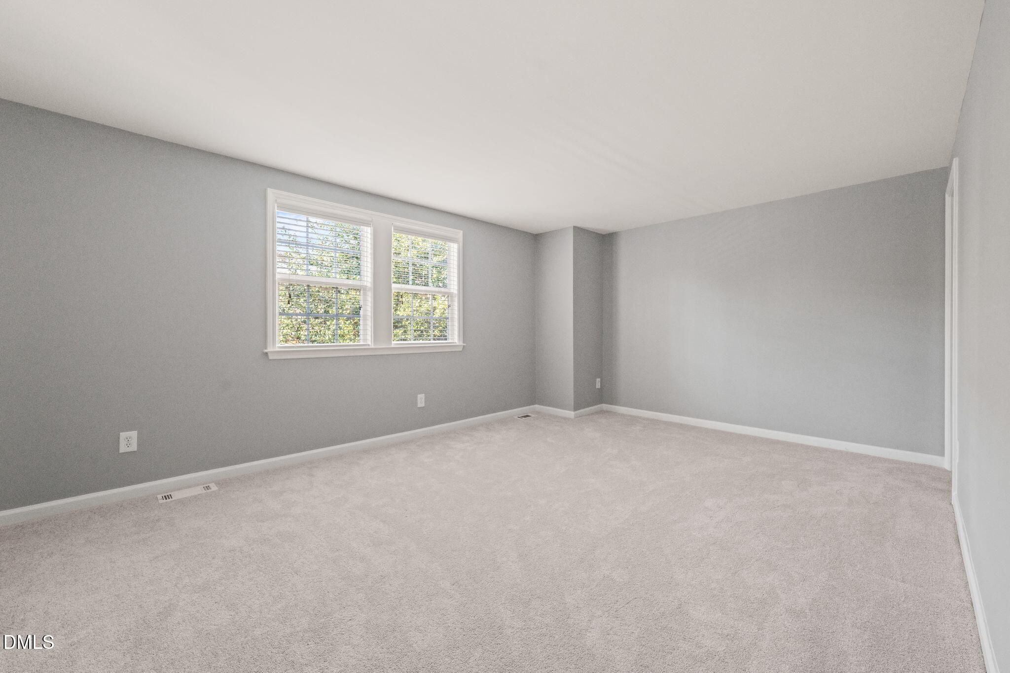7739 Ohmann Court Raleigh, NC 27615 - Photo 17 of 38 an empty room with windows