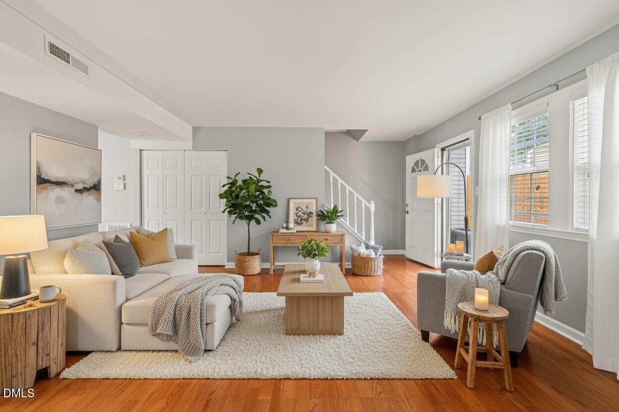 7739 Ohmann Court Raleigh, NC 27615 - Photo 2 of 38 a living room with furniture and a large window