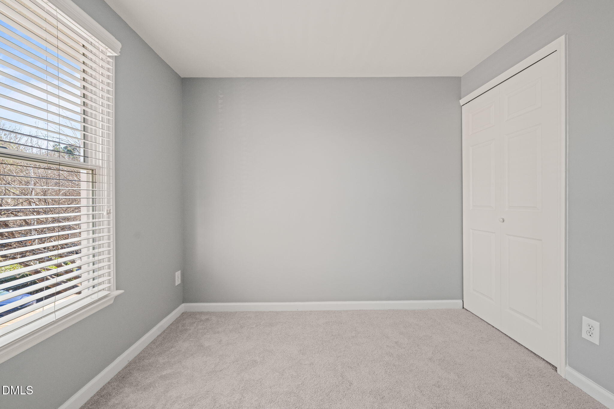 7739 Ohmann Court Raleigh, NC 27615 - Photo 22 of 38 an empty room with a window