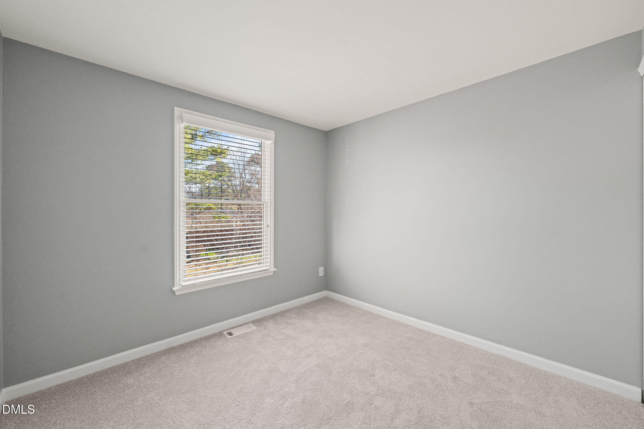 7739 Ohmann Court Raleigh, NC 27615 - Photo 23 of 38 a view of an empty room with a window