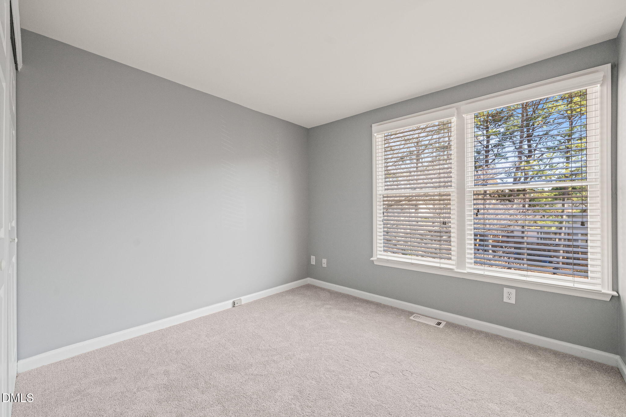 7739 Ohmann Court Raleigh, NC 27615 - Photo 25 of 38 a view of an empty room with a window