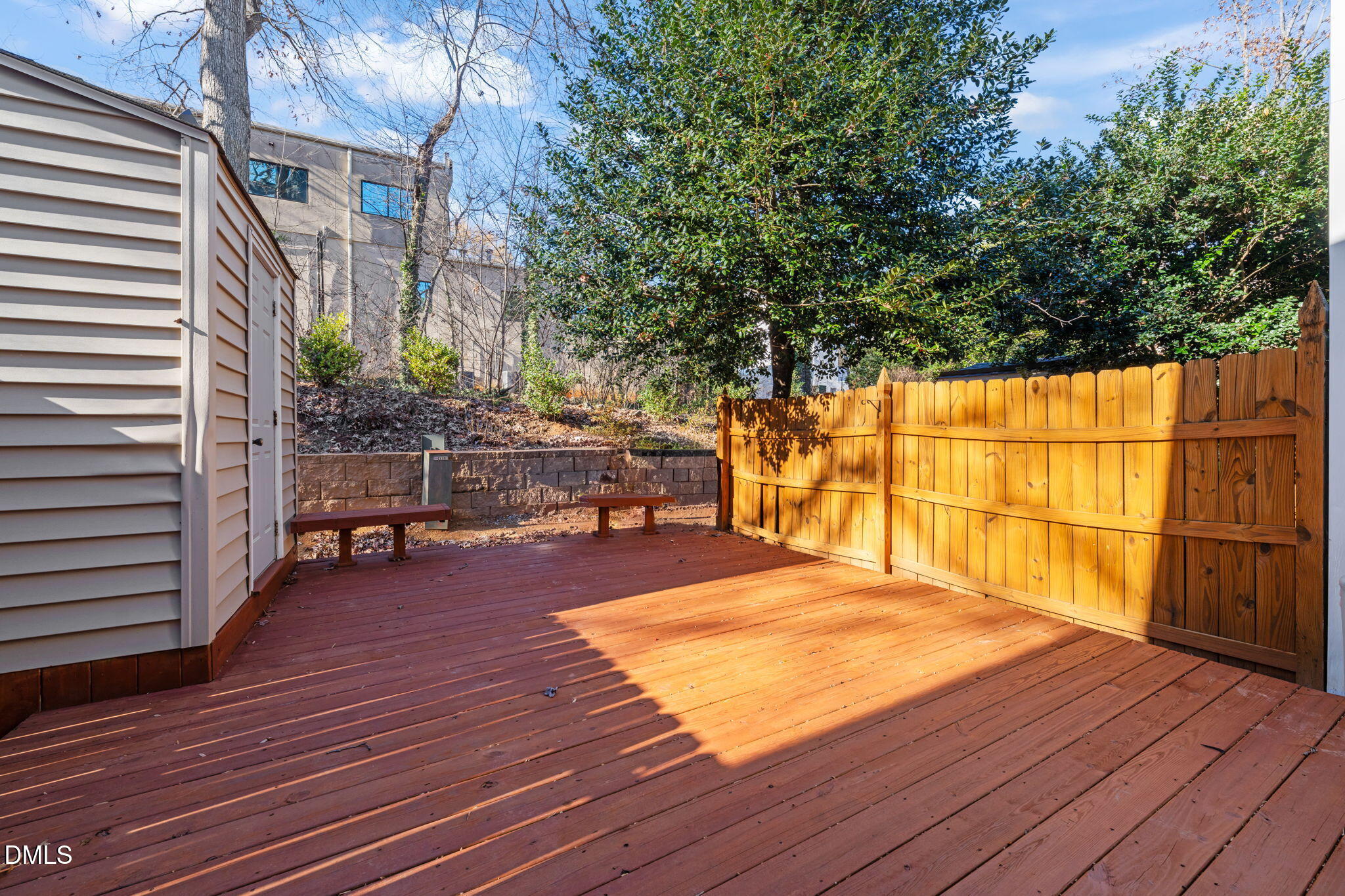 7739 Ohmann Court Raleigh, NC 27615 - Photo 31 of 38 a view of backyard with sitting area and wooden floor