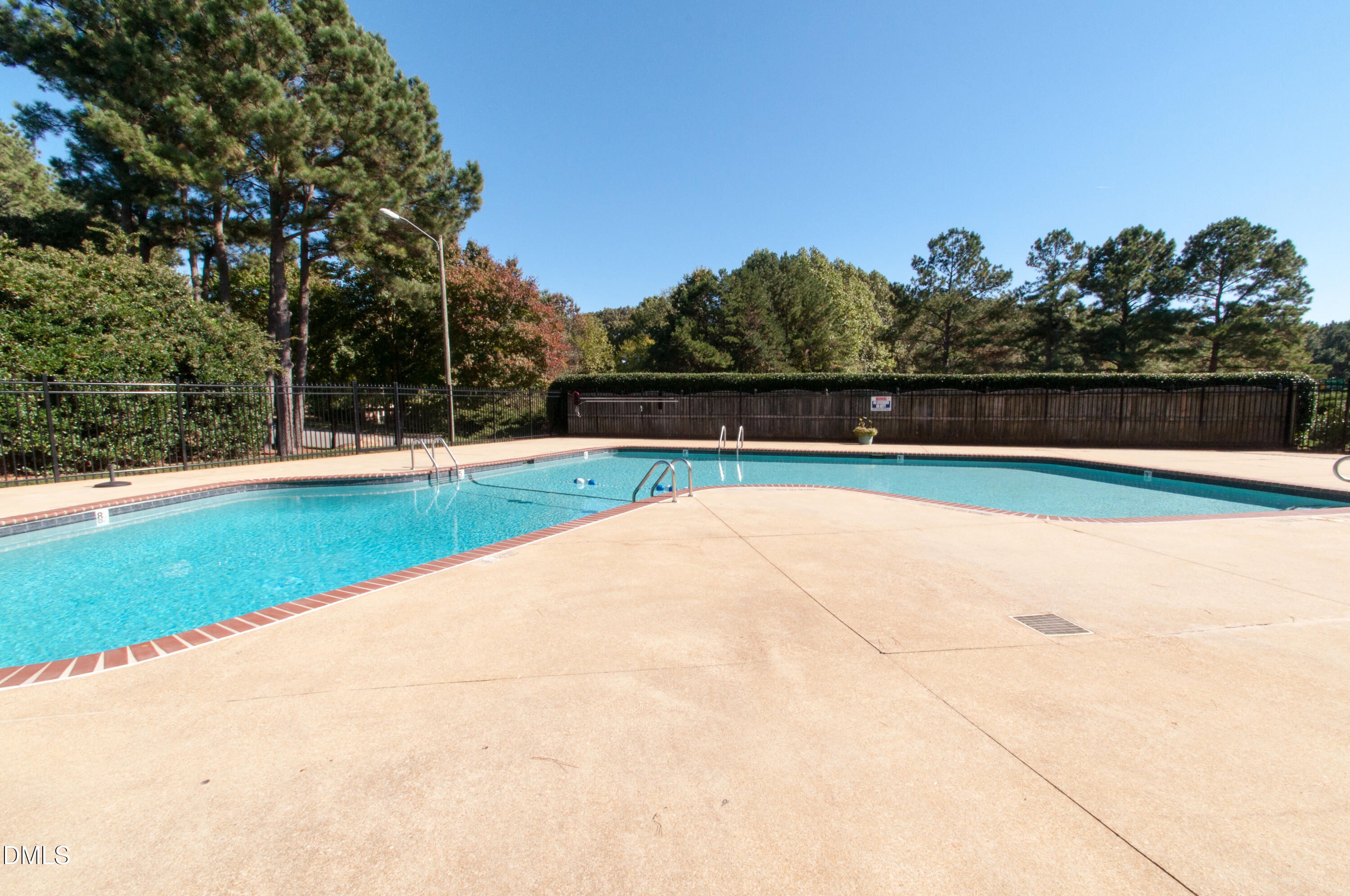 7739 Ohmann Court Raleigh, NC 27615 - Photo 36 of 38 a view of swimming pool with an outdoor space and seating area