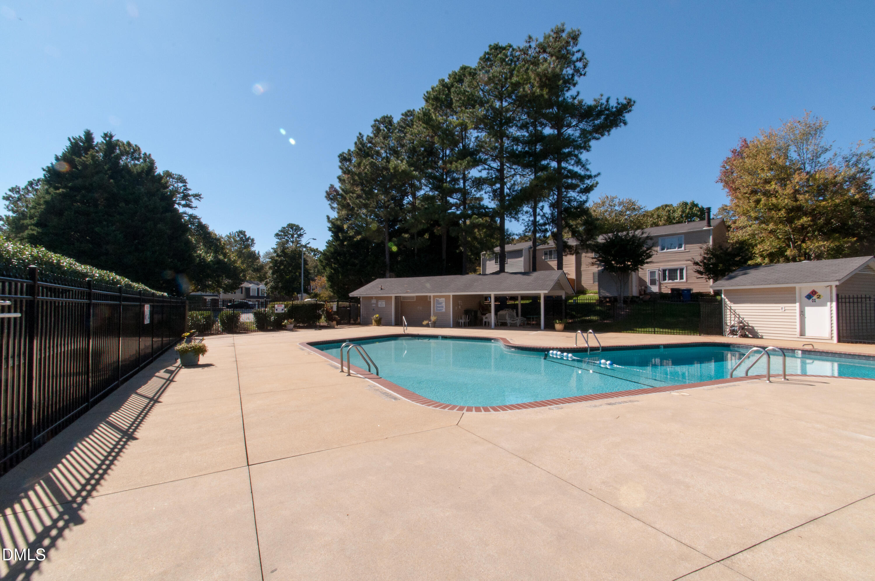 7739 Ohmann Court Raleigh, NC 27615 - Photo 37 of 38 a view of a swimming pool with a yard