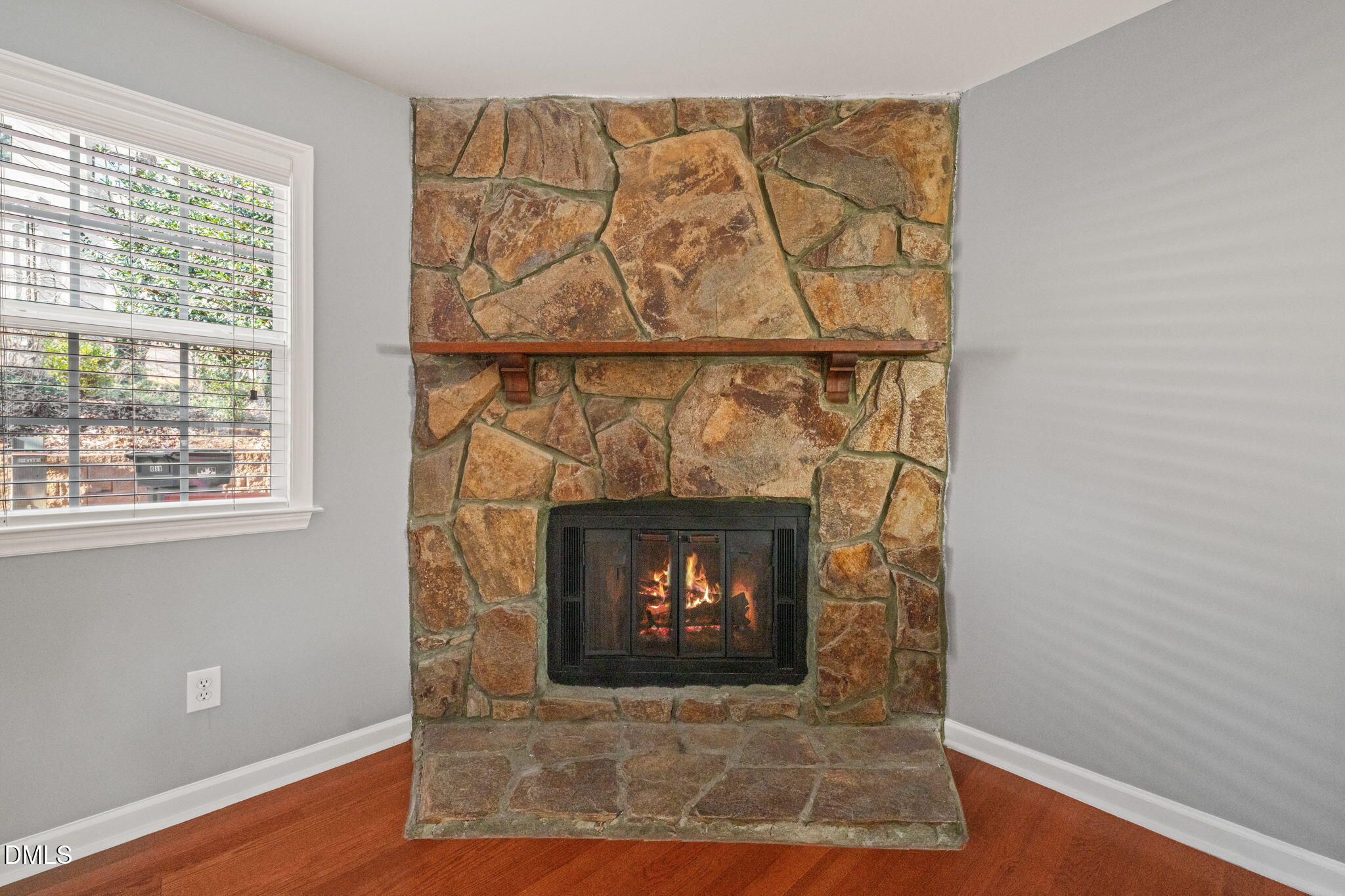 7739 Ohmann Court Raleigh, NC 27615 - Photo 6 of 38 a room with a fireplace