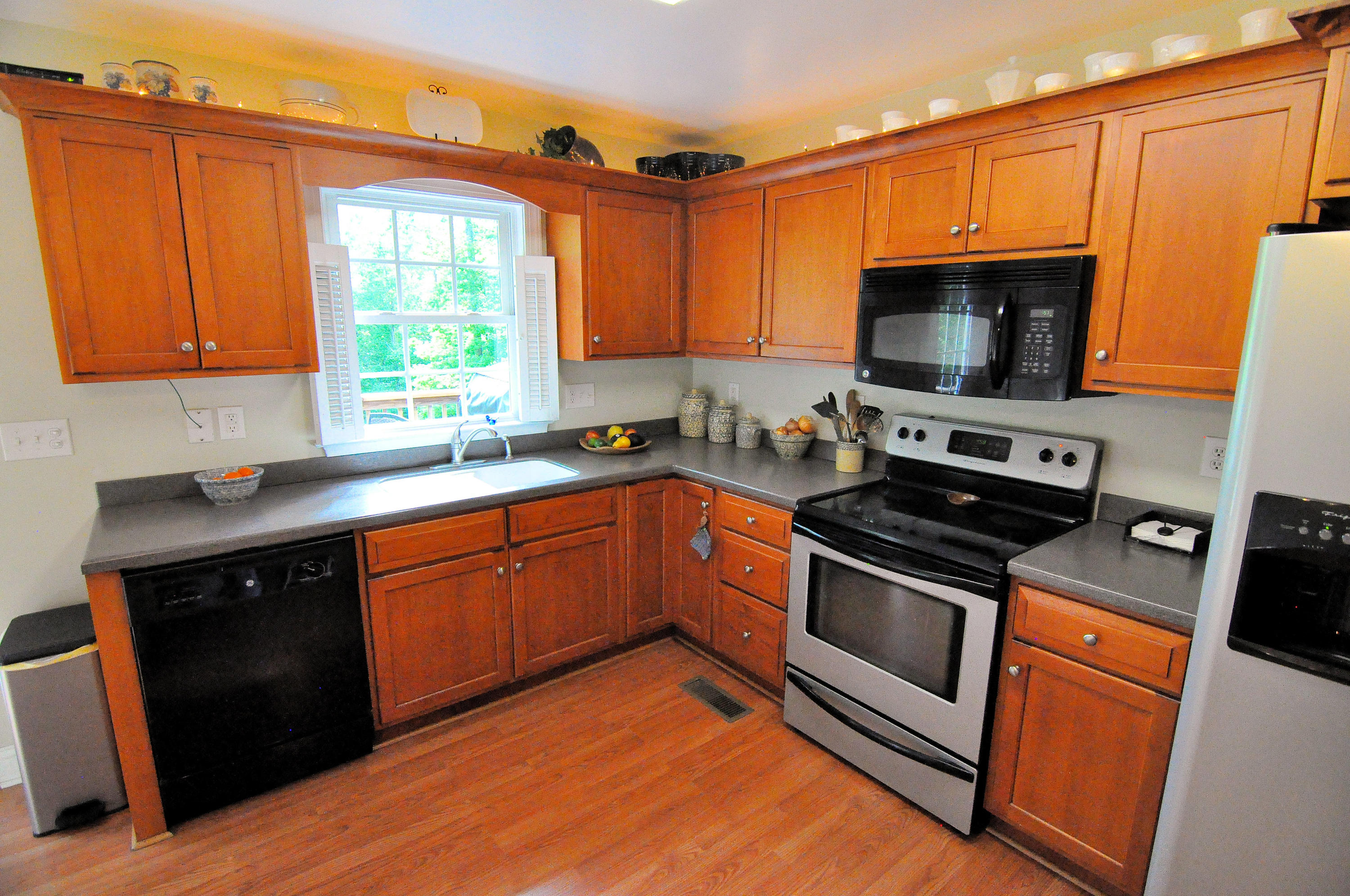 832 Old Henry Road Henry, VA 24102 - Photo 12 of 30 a kitchen with stainless steel appliances granite countertop a stove a sink and a microwave