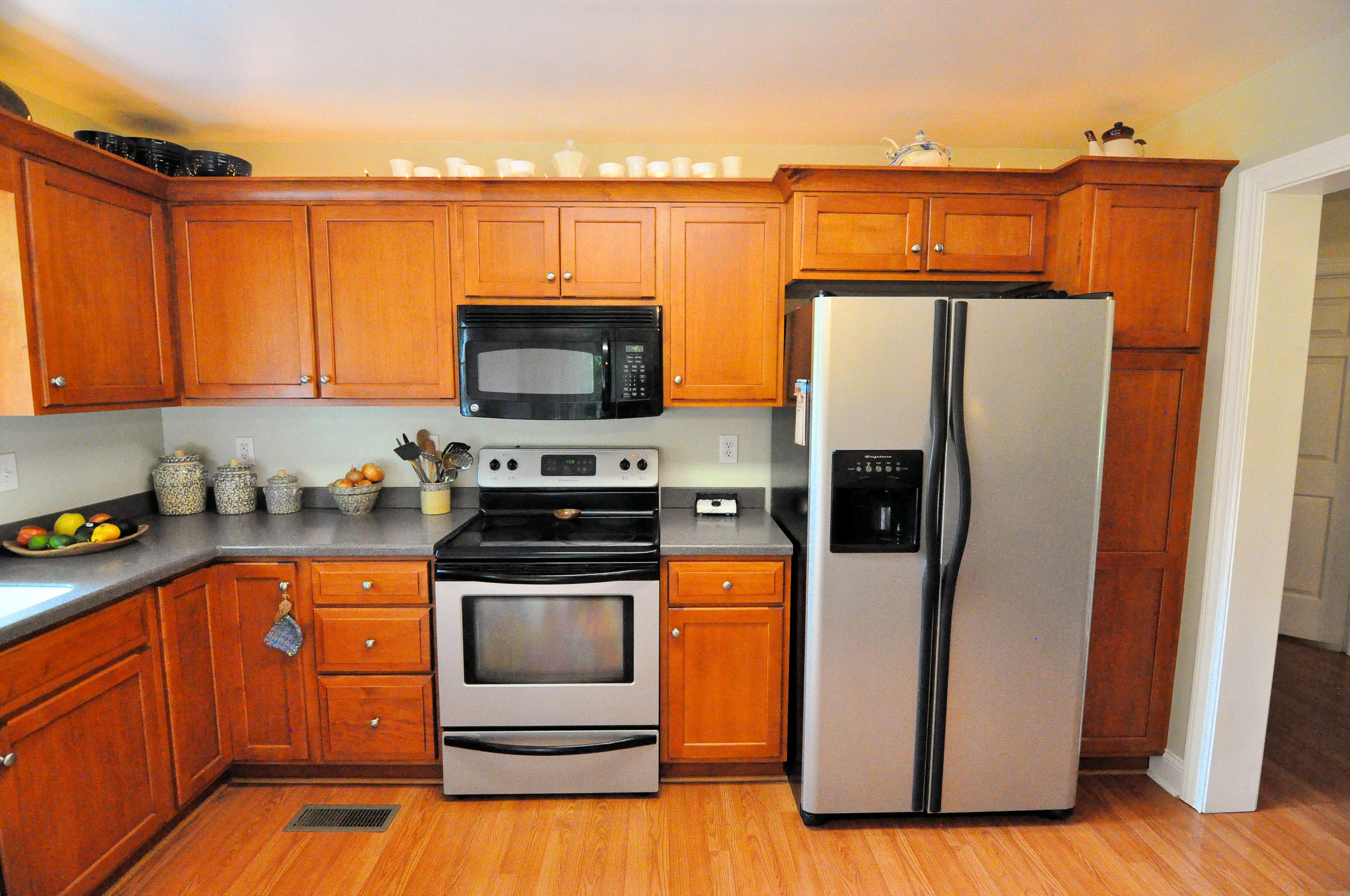 832 Old Henry Road Henry, VA 24102 - Photo 13 of 30 a kitchen with stainless steel appliances granite countertop a refrigerator stove and microwave