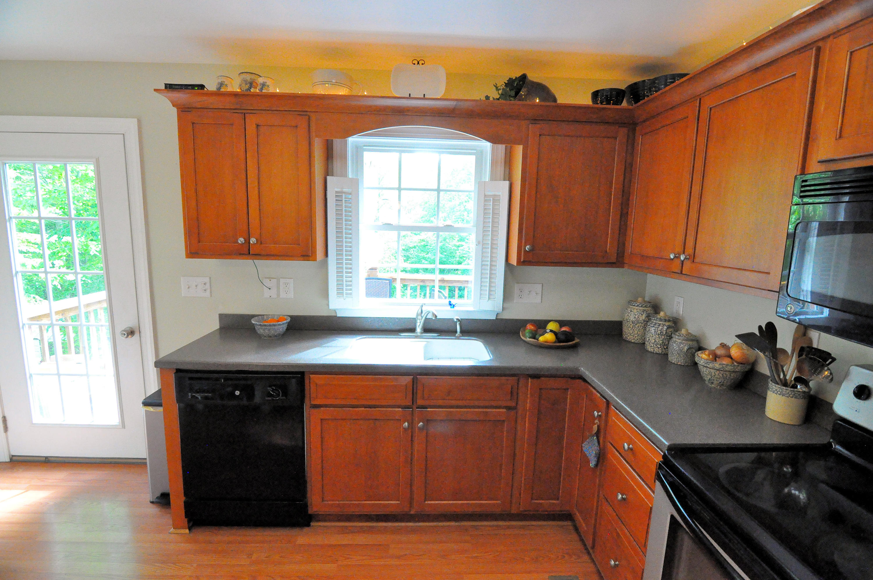 832 Old Henry Road Henry, VA 24102 - Photo 14 of 30 a kitchen with a sink a stove cabinets and a window