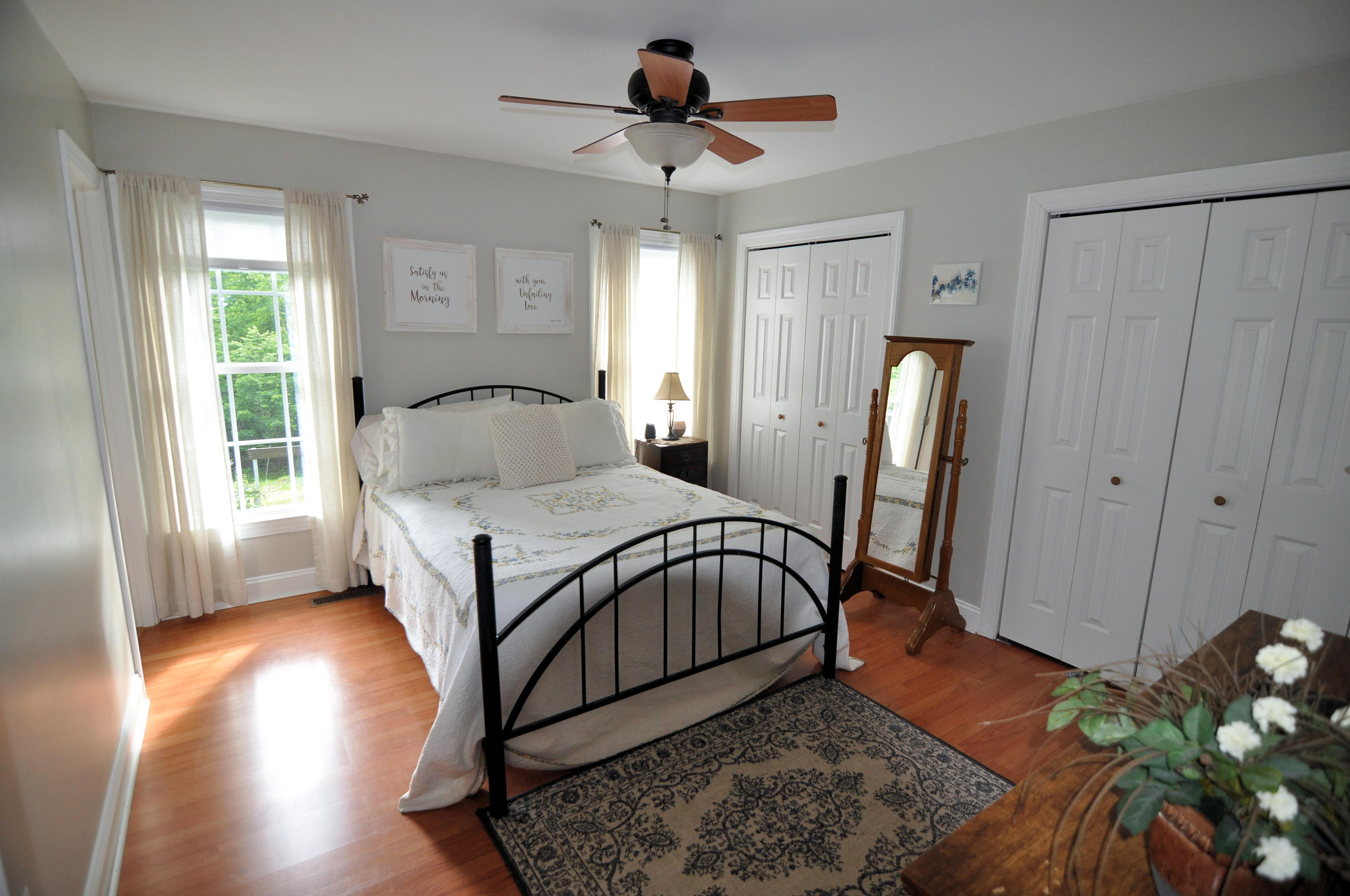 832 Old Henry Road Henry, VA 24102 - Photo 18 of 30 a bedroom with a bed and a chandelier