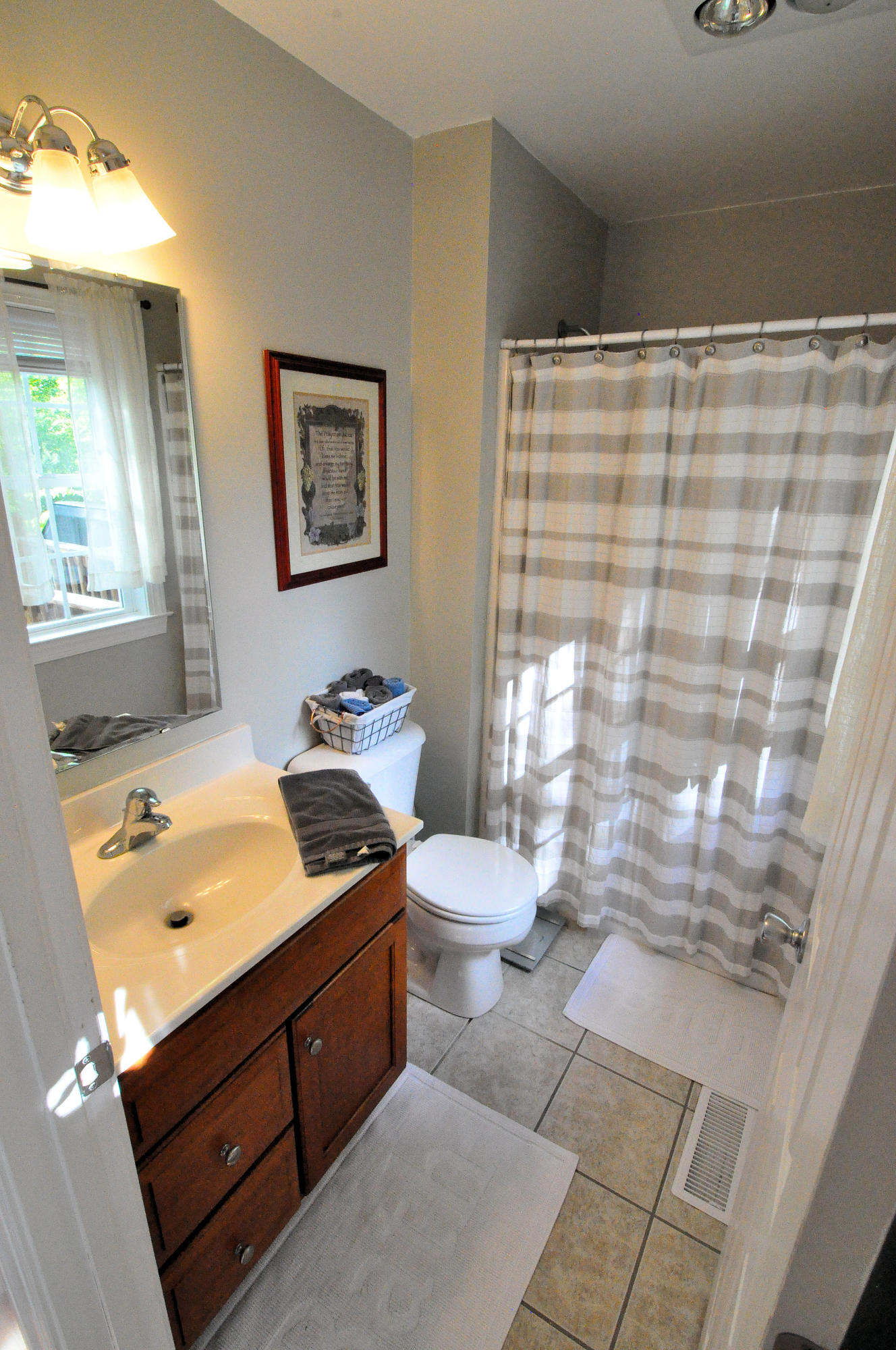 832 Old Henry Road Henry, VA 24102 - Photo 19 of 30 a bathroom with a granite countertop sink toilet and shower