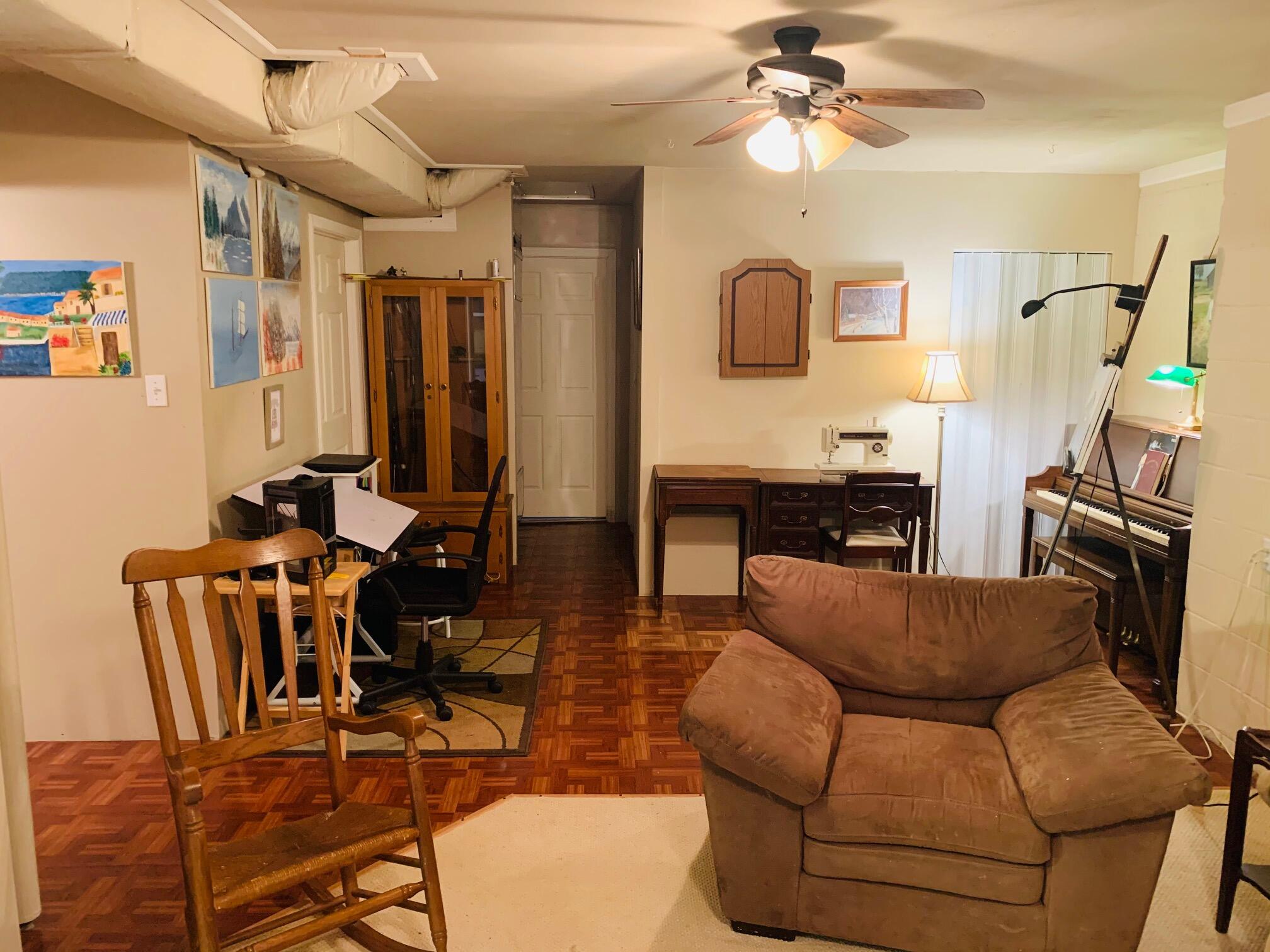 832 Old Henry Road Henry, VA 24102 - Photo 20 of 30 a living room with furniture a flat screen tv and a window