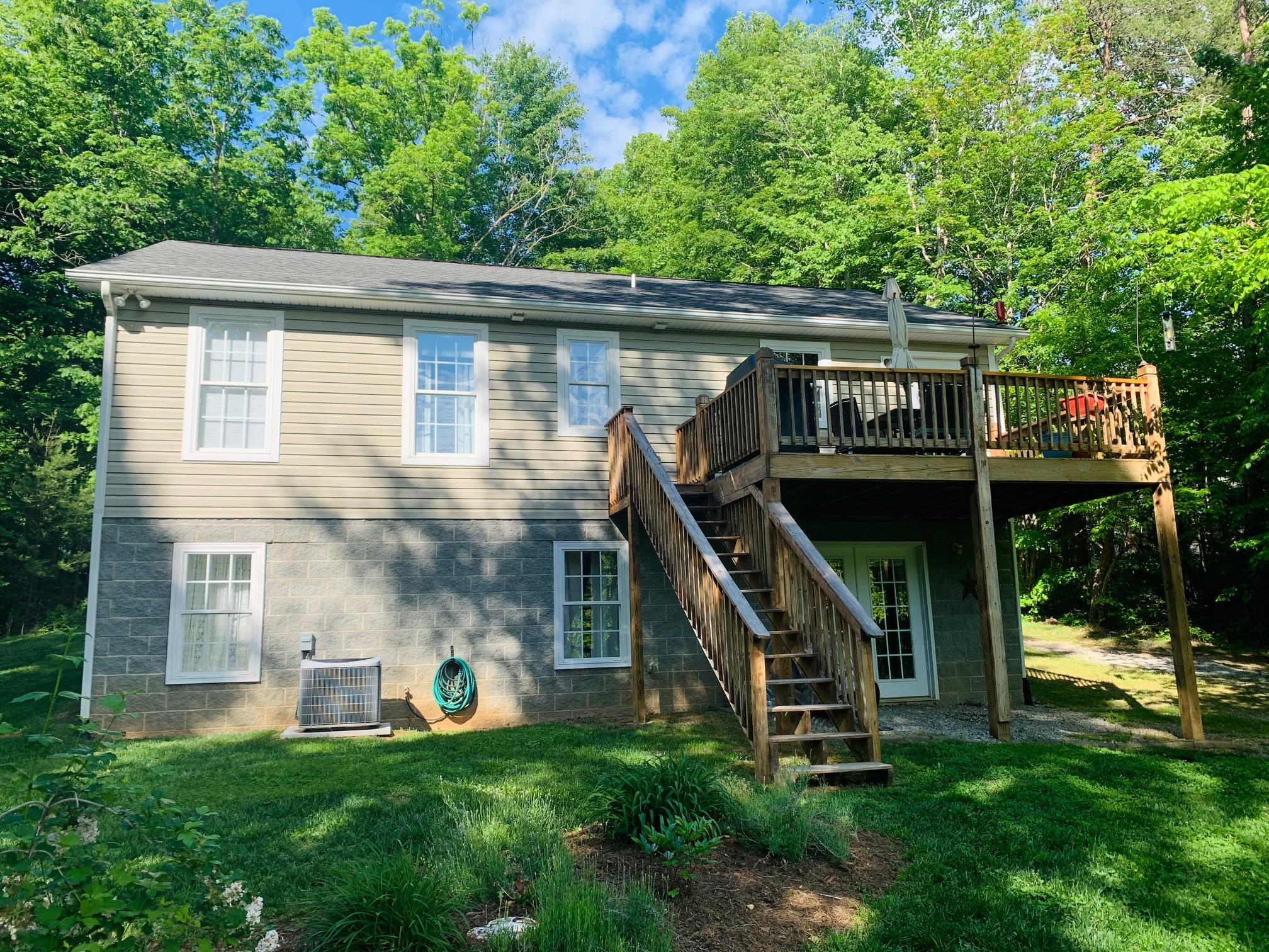832 Old Henry Road Henry, VA 24102 - Photo 3 of 30 a front view of house with a garden