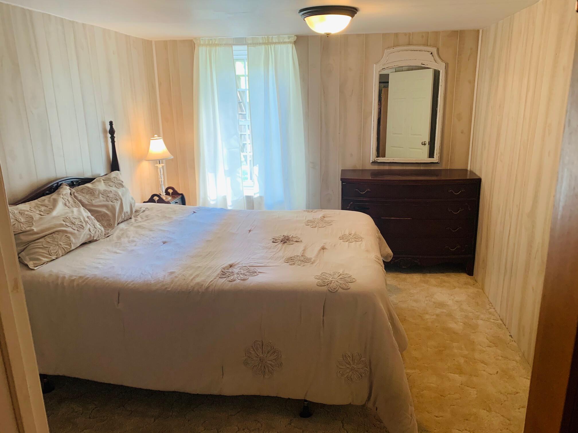 832 Old Henry Road Henry, VA 24102 - Photo 24 of 30 a bedroom with a bed and a window