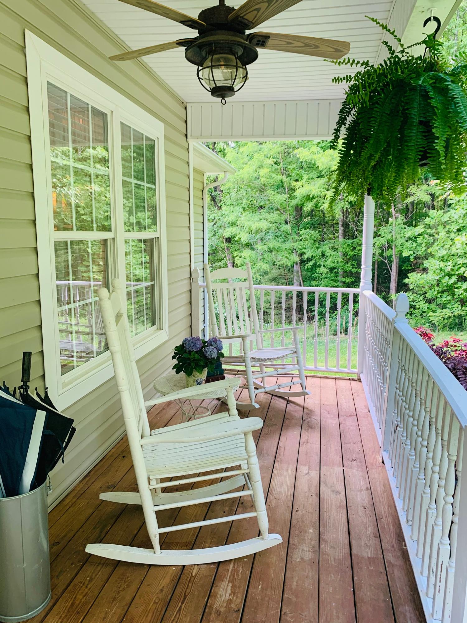 832 Old Henry Road Henry, VA 24102 - Photo 6 of 30 a view of balcony with wooden floor and outdoor seating