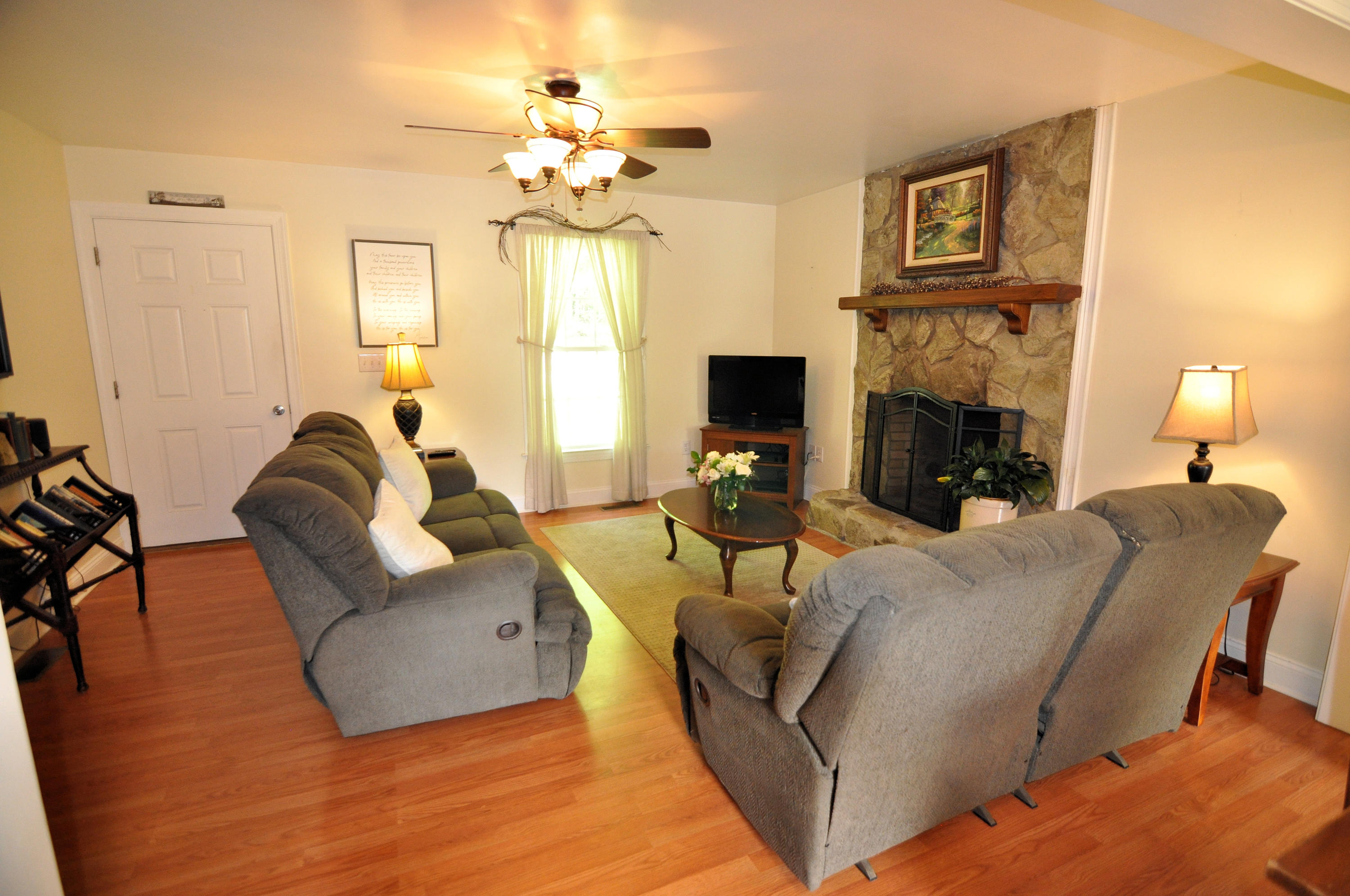 832 Old Henry Road Henry, VA 24102 - Photo 7 of 30 a living room with furniture and a fireplace