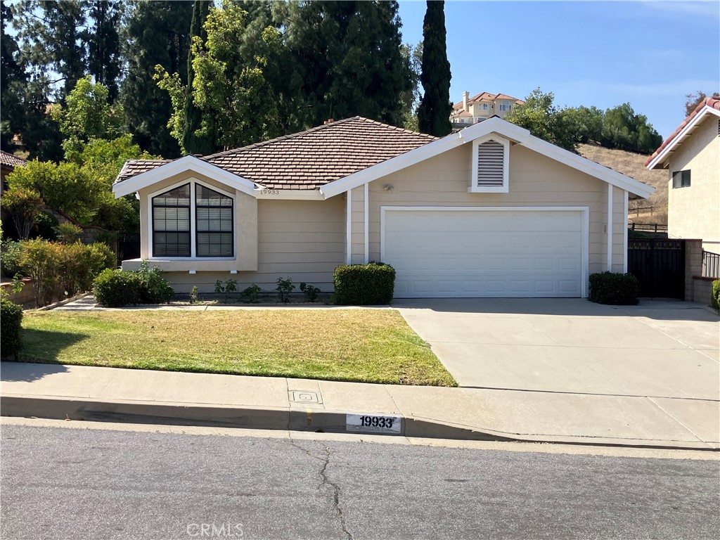 19933 Ralph Street Walnut, CA 91789 - Photo 1 of 77 a front view of a house with garage and plants