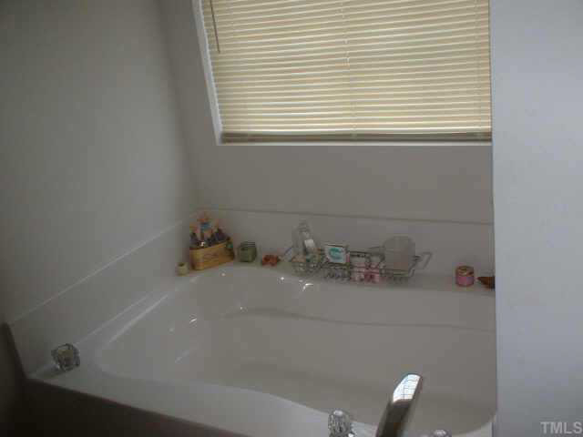 7413 Lowell Ridge Road Raleigh, NC 27616 - Photo 9 of 10 a bathroom with a sink and a window