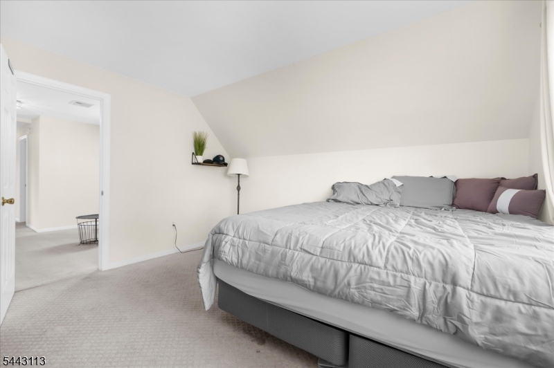 54 Rick Road Milford, NJ 08848 - Photo 28 of 50 a bedroom with a bed and a couch