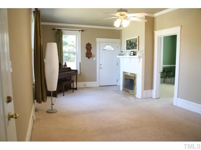 2613 Banks Road Raleigh, NC 27603 - Photo 2 of 12 a view of a livingroom with a tub and workspace