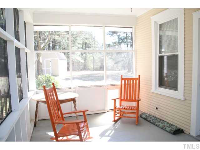 2613 Banks Road Raleigh, NC 27603 - Photo 6 of 12 a dining room with wooden floor and a floor to ceiling window