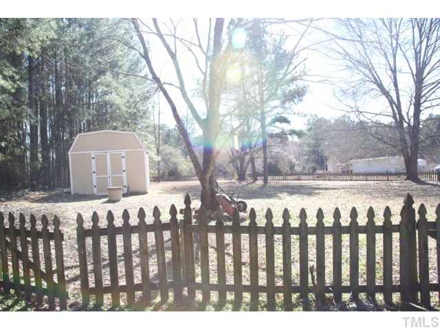 2613 Banks Road Raleigh, NC 27603 - Photo 8 of 12 a front view of a house with a garden