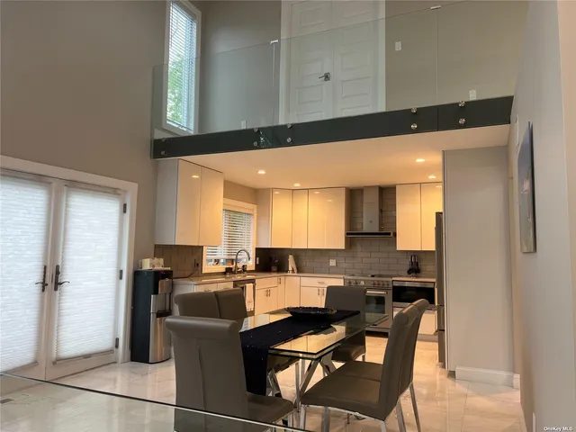 a kitchen with a refrigerator and cabinets