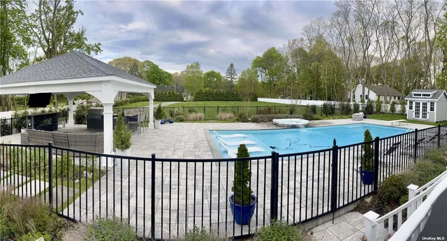 a view of a wooden house with a yard