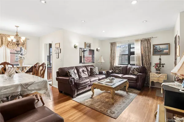 a living room with furniture or couch and a lamp