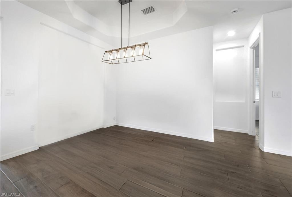 43240 Boardwalk Loop Punta Gorda, FL 33982 - Photo 18 of 41 a view of a room with wooden floor and ceiling fan