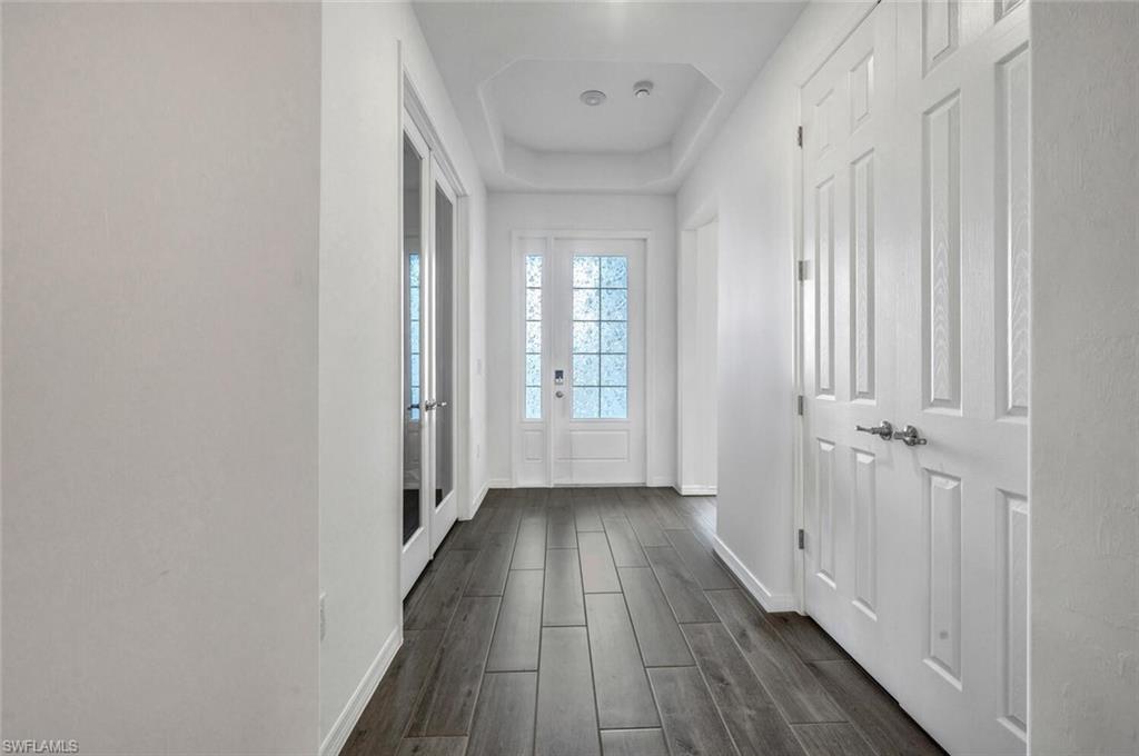 43240 Boardwalk Loop Punta Gorda, FL 33982 - Photo 27 of 41 a view of a hallway with wooden floor