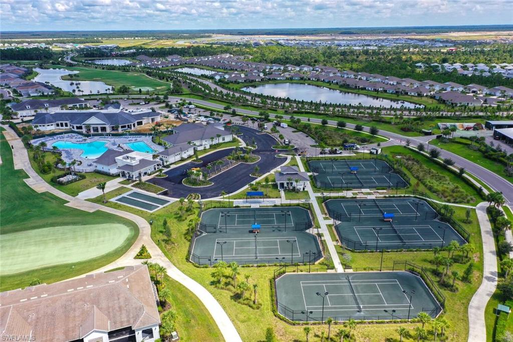 43240 Boardwalk Loop Punta Gorda, FL 33982 - Photo 35 of 41 an aerial view of a swimming pool with a yard