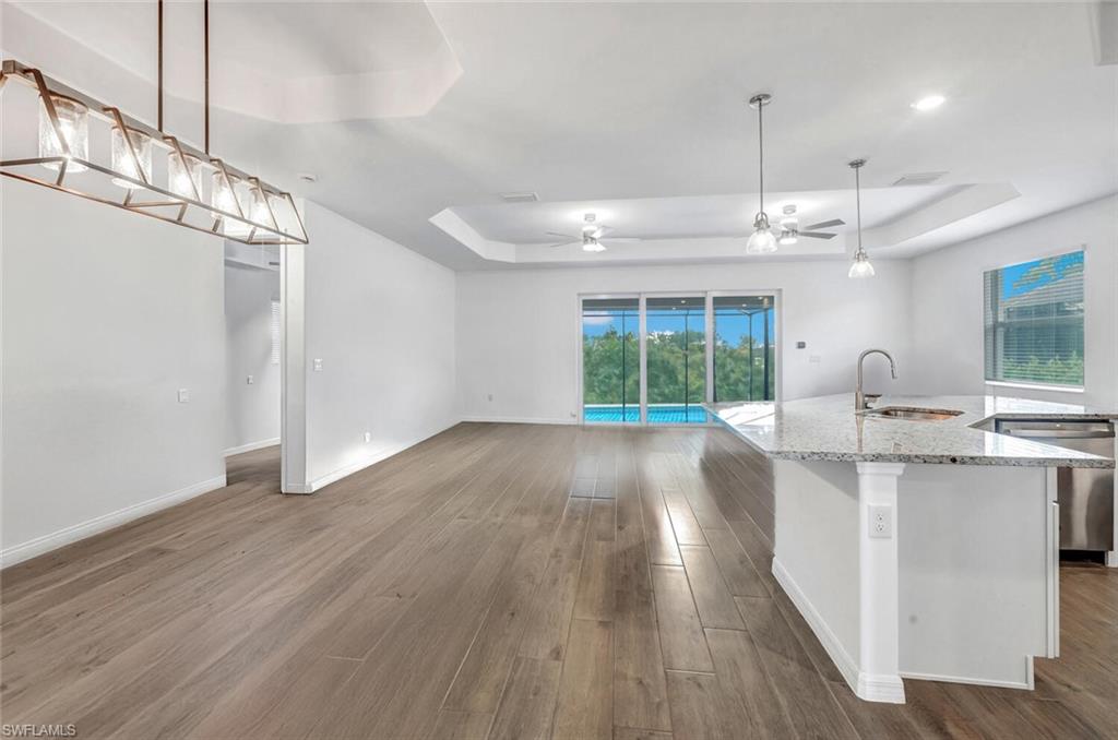 43240 Boardwalk Loop Punta Gorda, FL 33982 - Photo 10 of 41 a view of kitchen and center island wooden floor