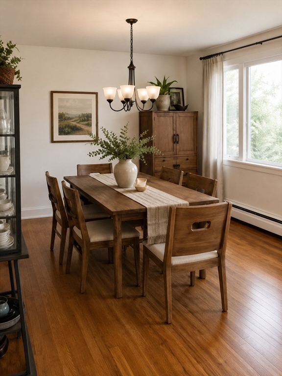 132 Brandeis Road Newton, MA 02459 - Photo 3 of 10 a view of a dining room with furniture and wooden floor