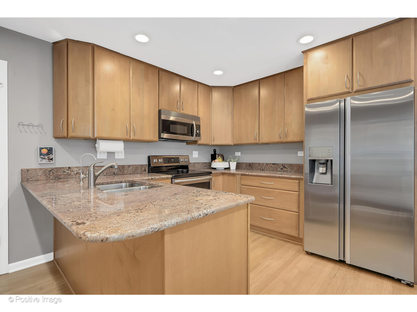 3672 Venard Road Downers Grove, IL 60515 - Photo 12 of 44 a kitchen with kitchen island granite countertop a sink stainless steel appliances and counter space