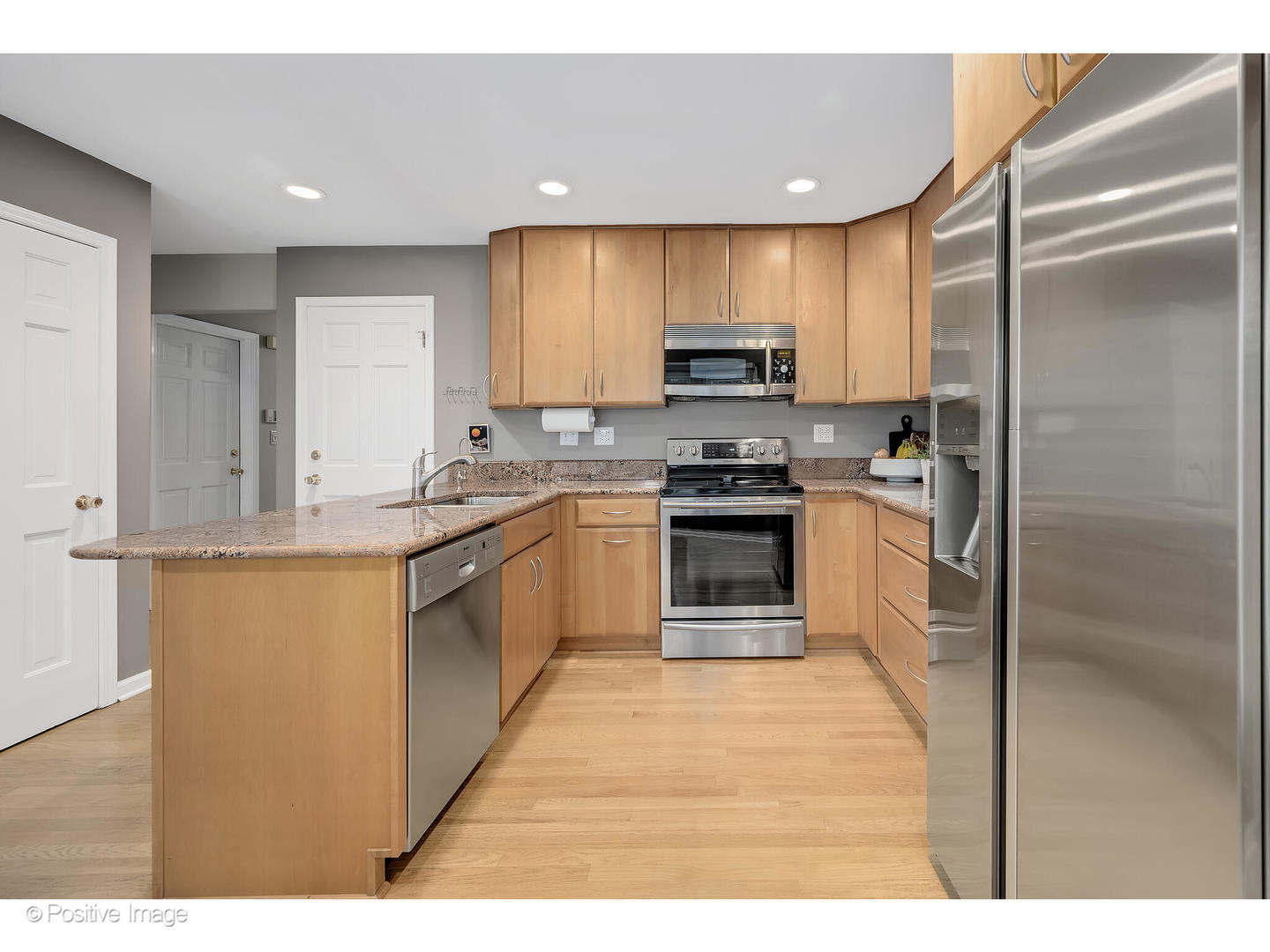 3672 Venard Road Downers Grove, IL 60515 - Photo 13 of 44 a kitchen with stainless steel appliances granite countertop a stove top oven a sink and a refrigerator