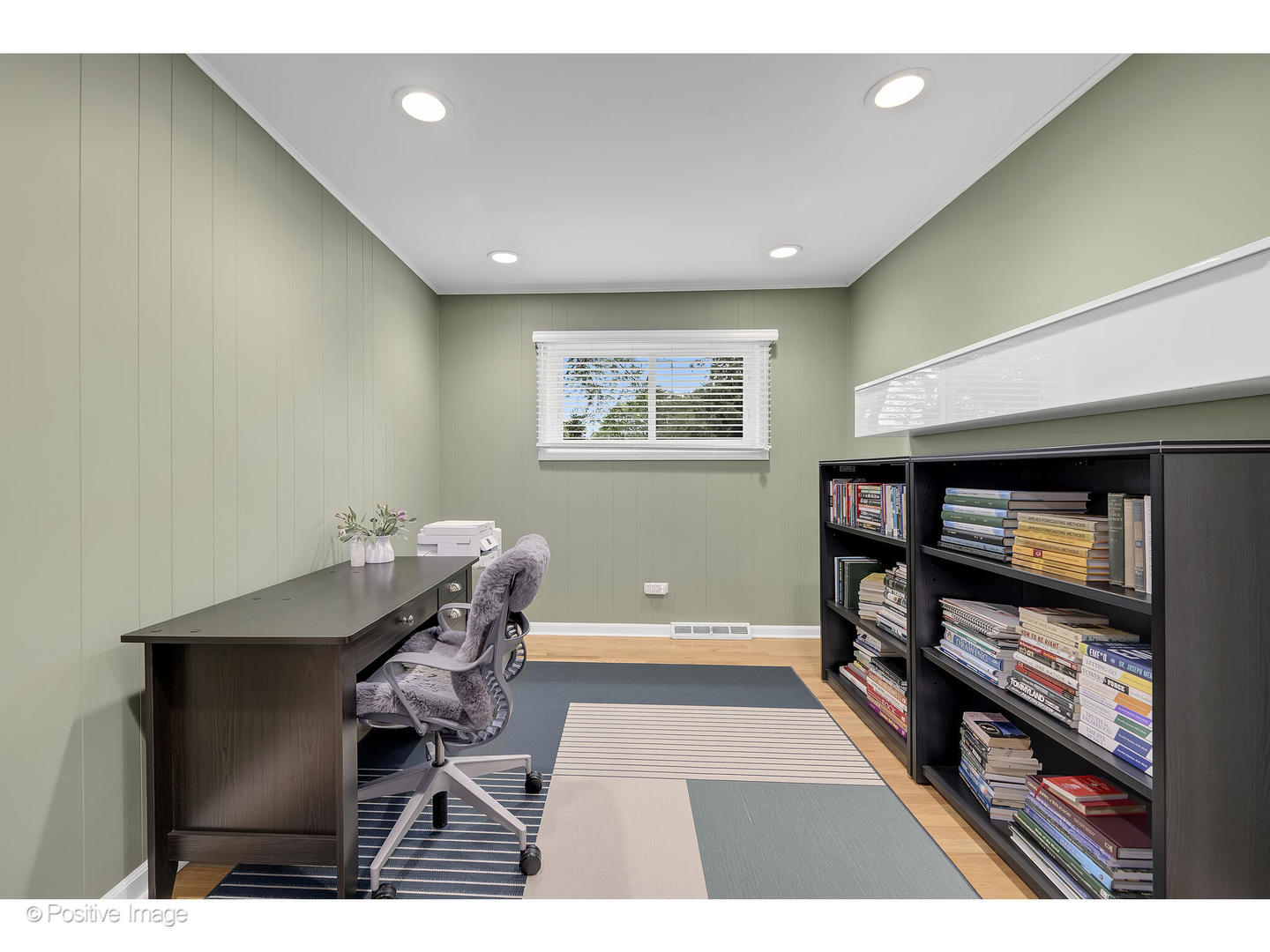 3672 Venard Road Downers Grove, IL 60515 - Photo 19 of 44 a living room with furniture a flat screen tv and a table