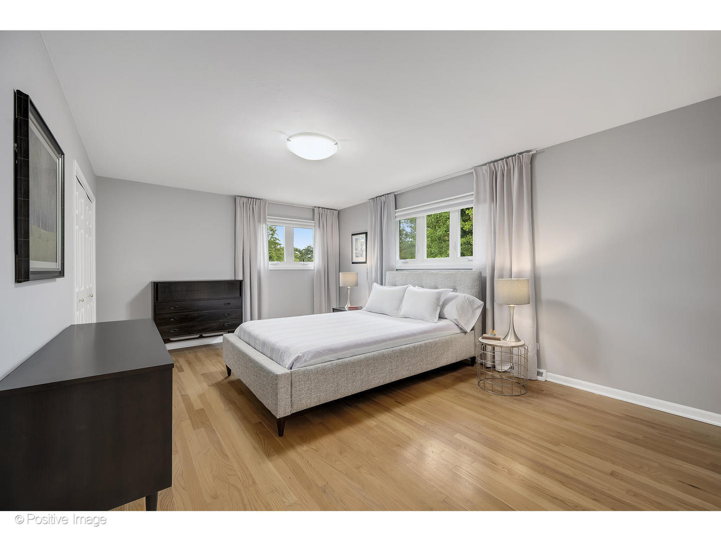 3672 Venard Road Downers Grove, IL 60515 - Photo 21 of 44 a bedroom with a bed window and a flat screen tv