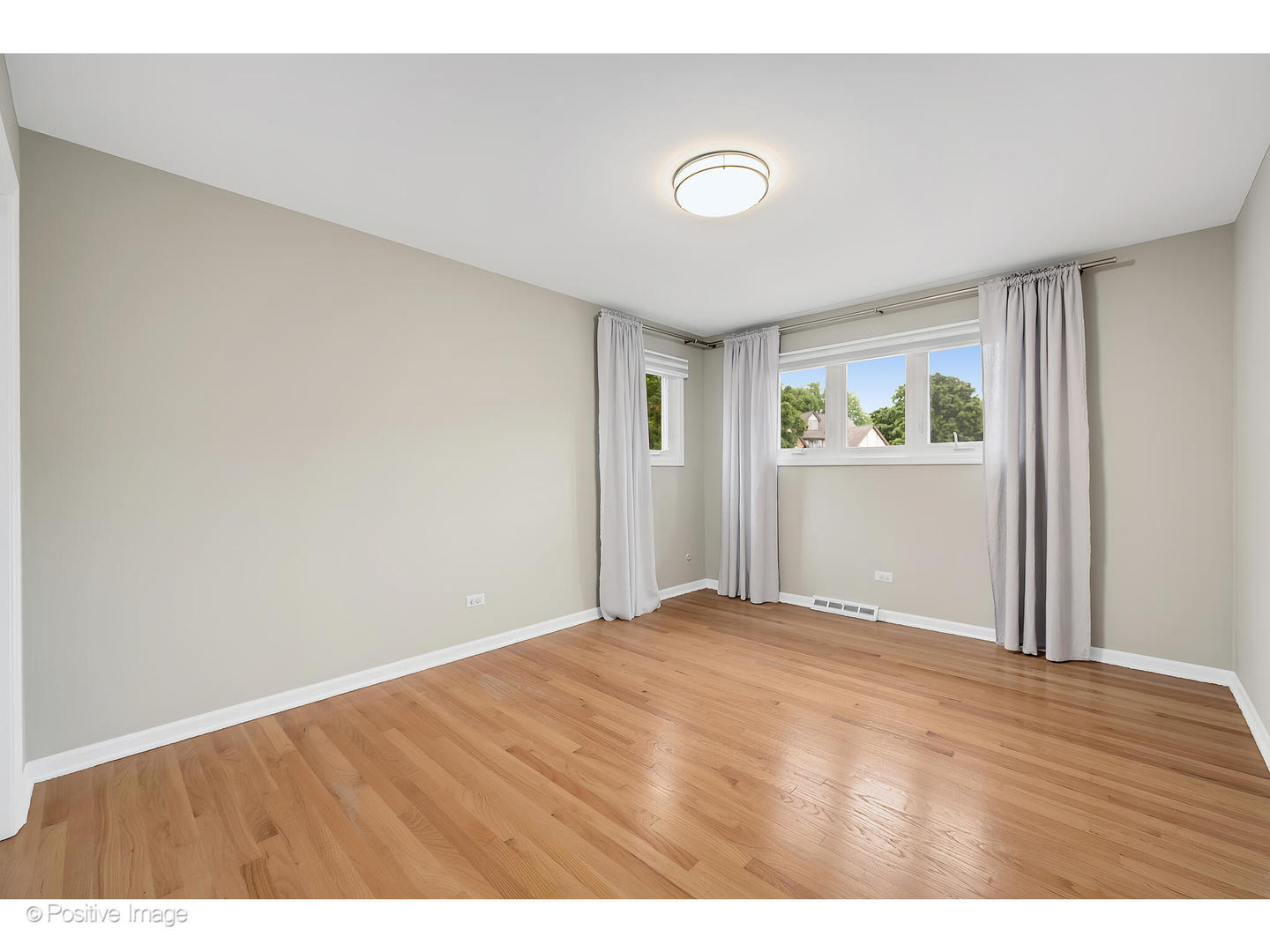 3672 Venard Road Downers Grove, IL 60515 - Photo 26 of 44 a view of an empty room with wooden floor and a window