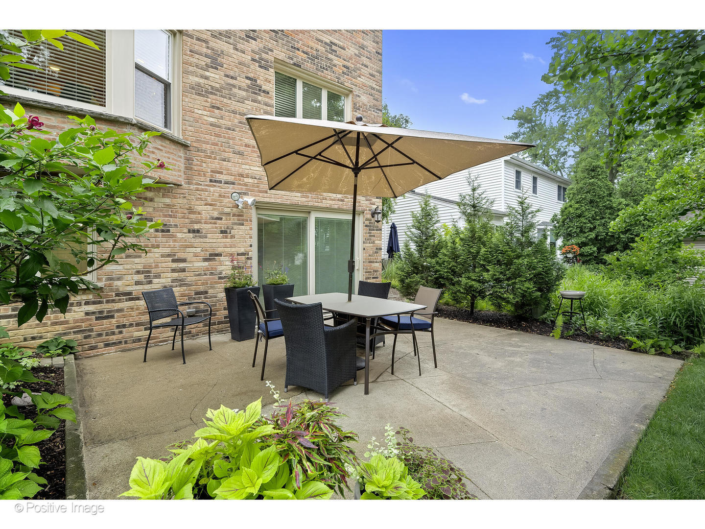 3672 Venard Road Downers Grove, IL 60515 - Photo 32 of 44 a view of a tables and chairs under an umbrella