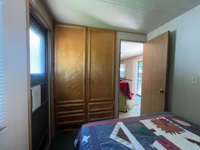 2795 East 28th Road Marseilles, IL 61341 - Photo 15 of 68 a bedroom with a bed and a mirror