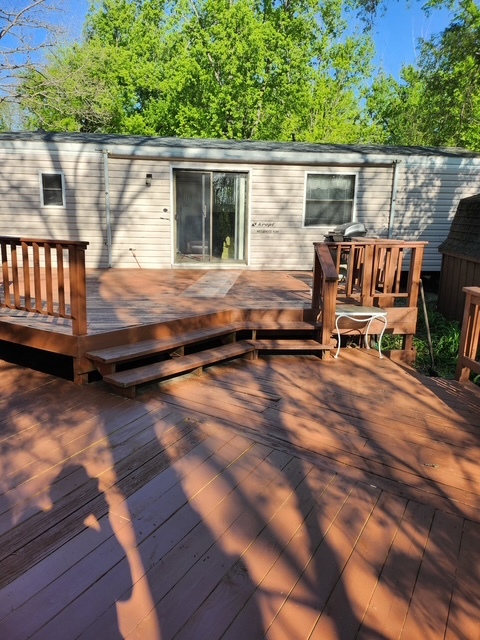 2795 East 28th Road Marseilles, IL 61341 - Photo 26 of 68 a backyard of a house with wooden floor table and chairs