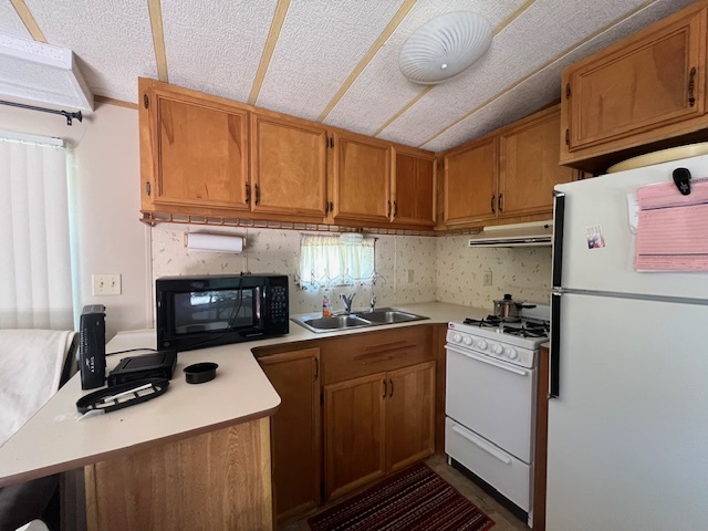 2795 East 28th Road Marseilles, IL 61341 - Photo 9 of 68 a kitchen with a sink stove and refrigerator