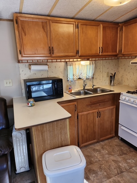 2795 East 28th Road Marseilles, IL 61341 - Photo 10 of 68 a kitchen with a sink cabinets and a wooden floor