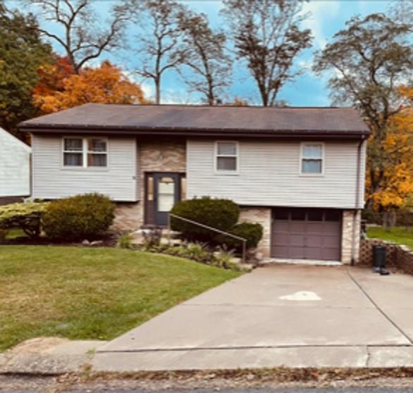 113 Louis Drive McKees Rocks, PA 15136 - Photo 1 of 25 a house view with a garden space