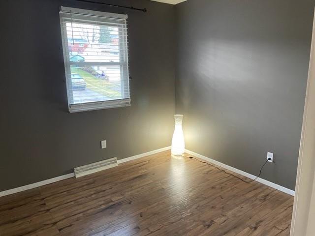 113 Louis Drive McKees Rocks, PA 15136 - Photo 15 of 25 an empty room with wooden floor and windows