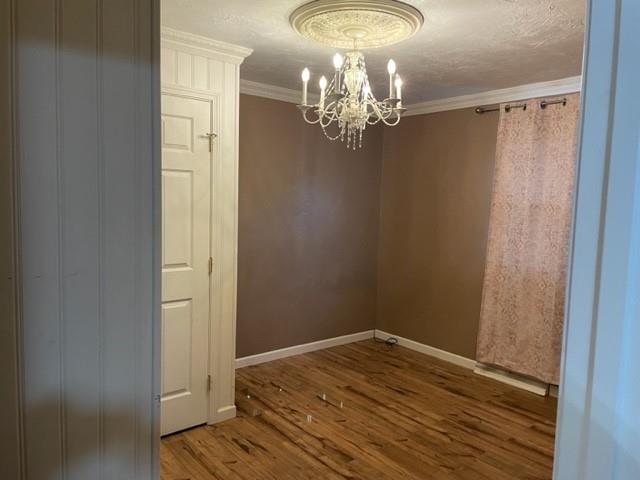 113 Louis Drive McKees Rocks, PA 15136 - Photo 16 of 25 a view of a room with wooden floor and chandelier